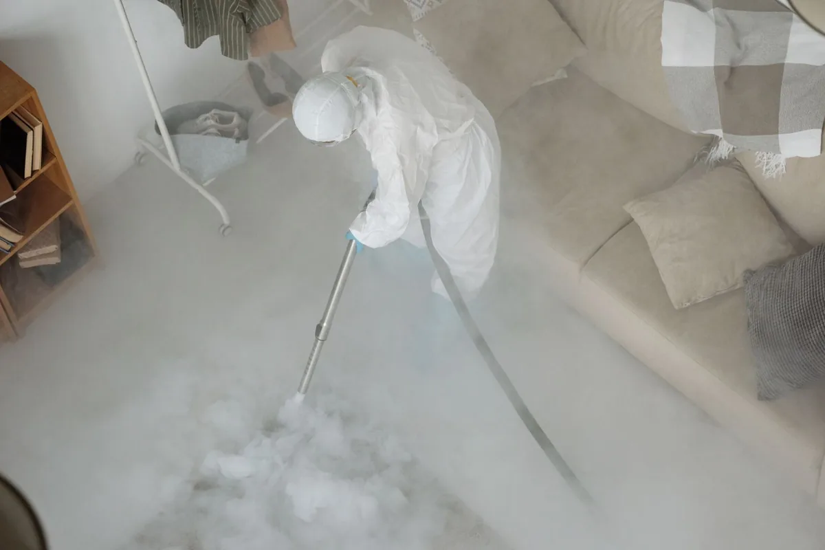 Biohazard cleanup technician in protective equipment, Moorefield, VA